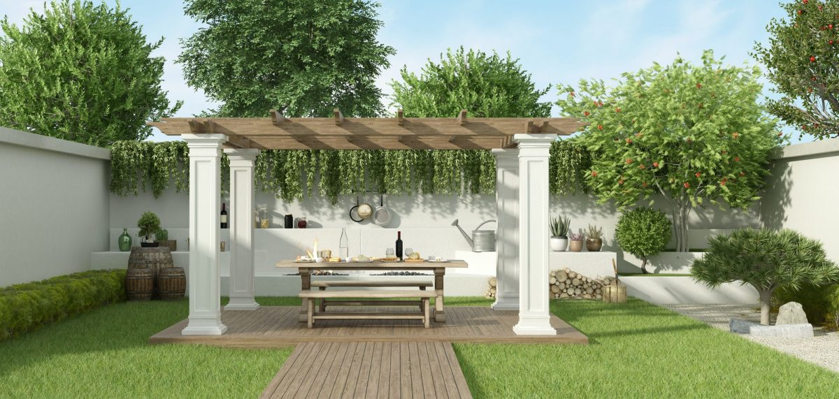 Lush garden with table set under a gazebo and barbecue on background